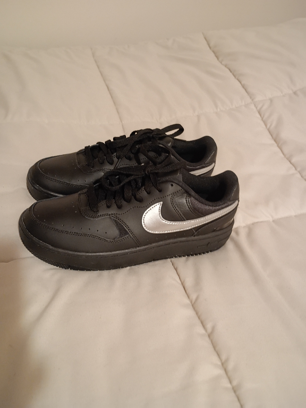Nike Black Low-Top Sneakers with Silver Swoosh